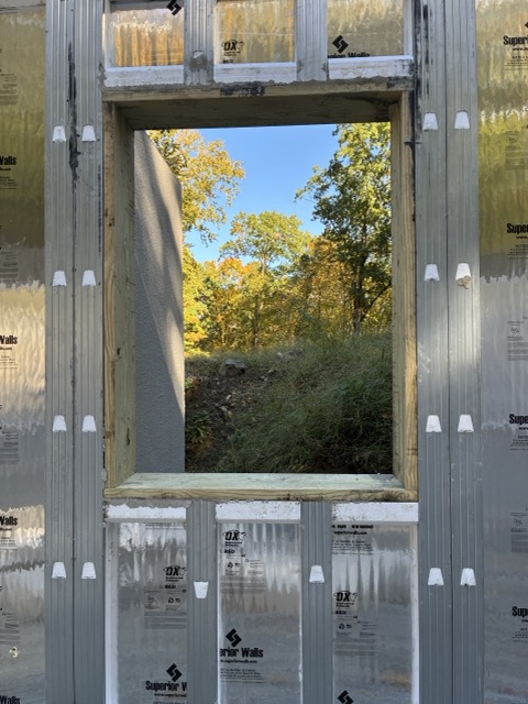 Basement egress window opening in the foundation