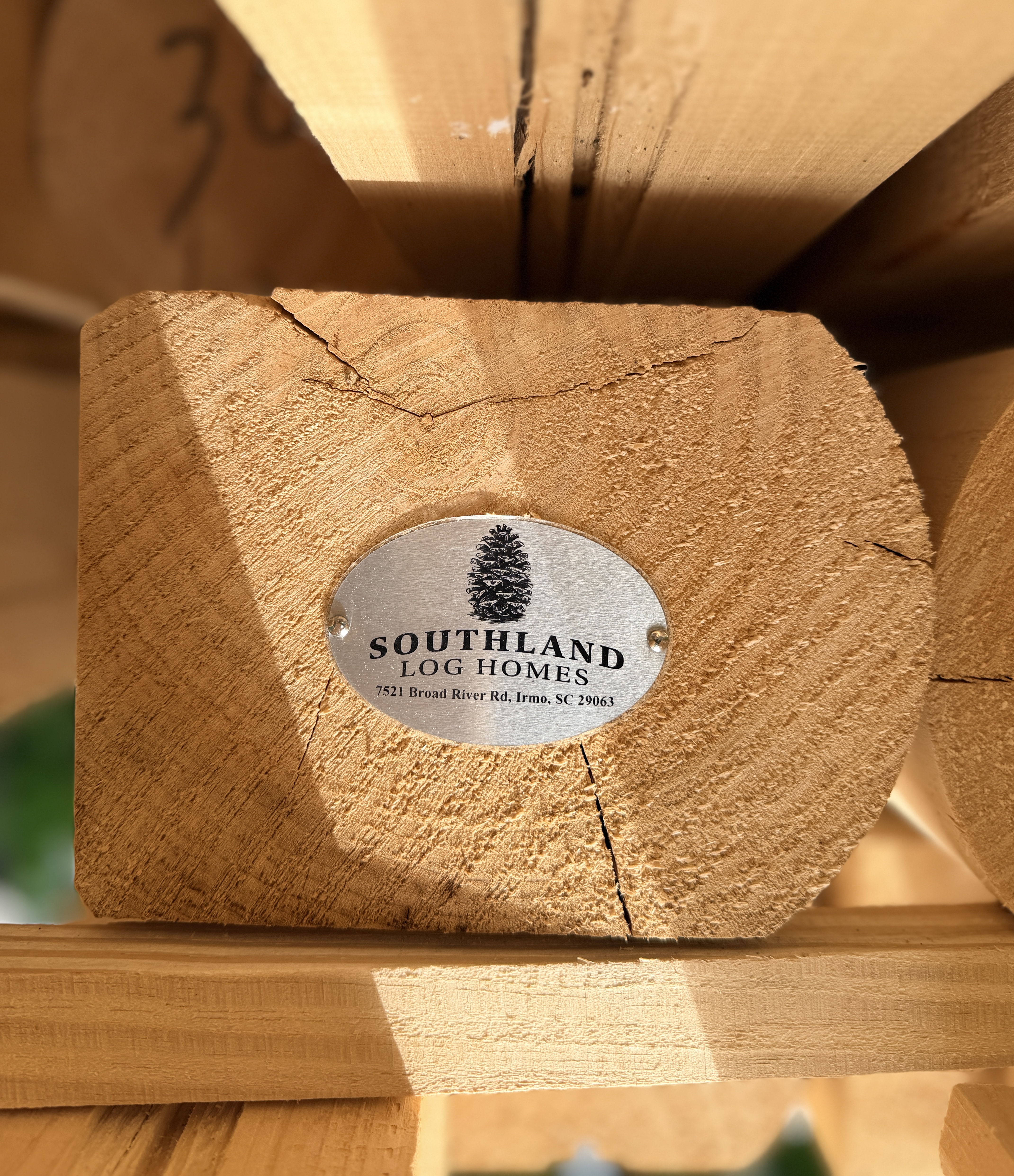 southland plaque on logs